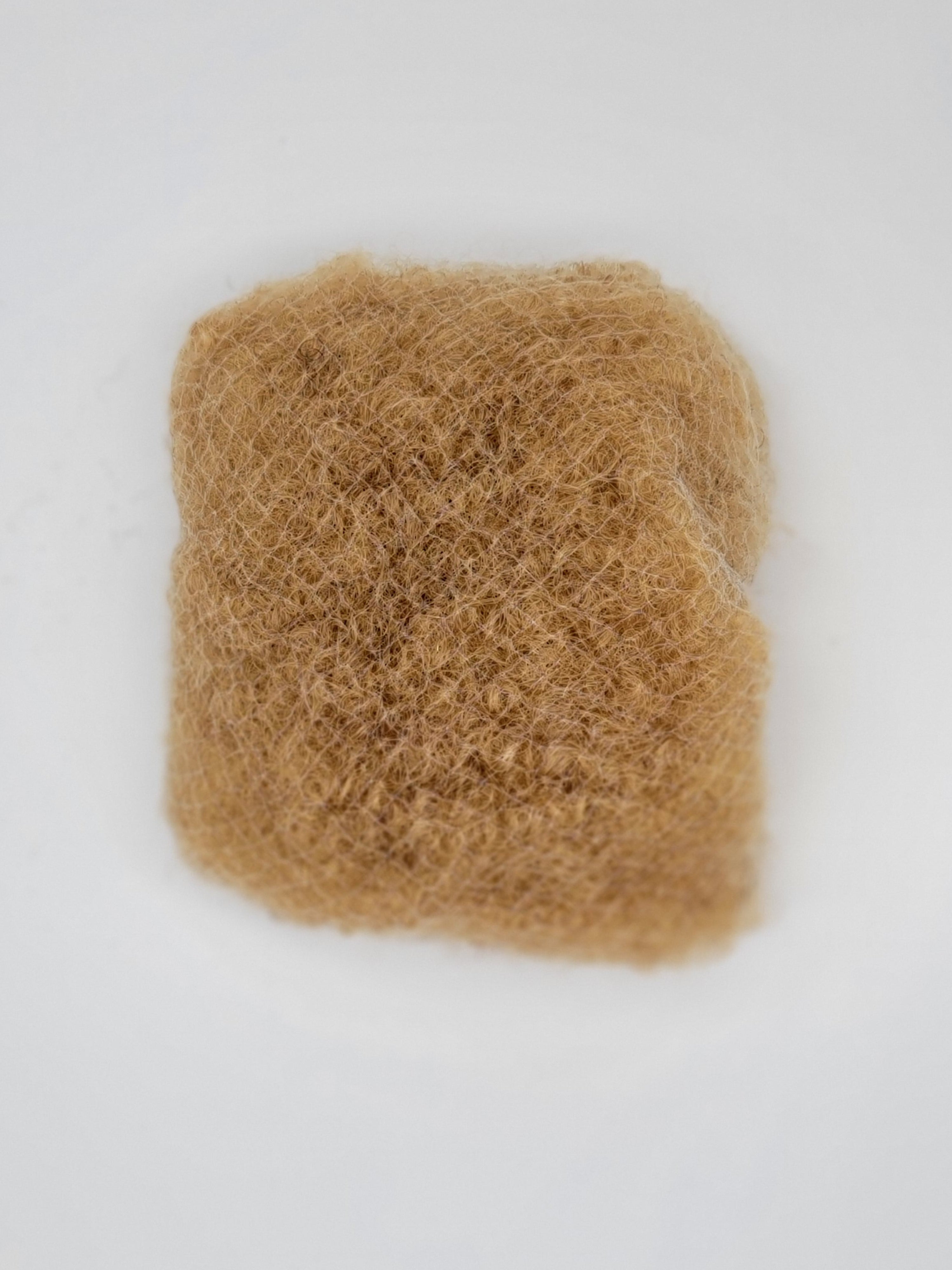 A bundle of DKEight loose bulk 4C brown hair against a white background