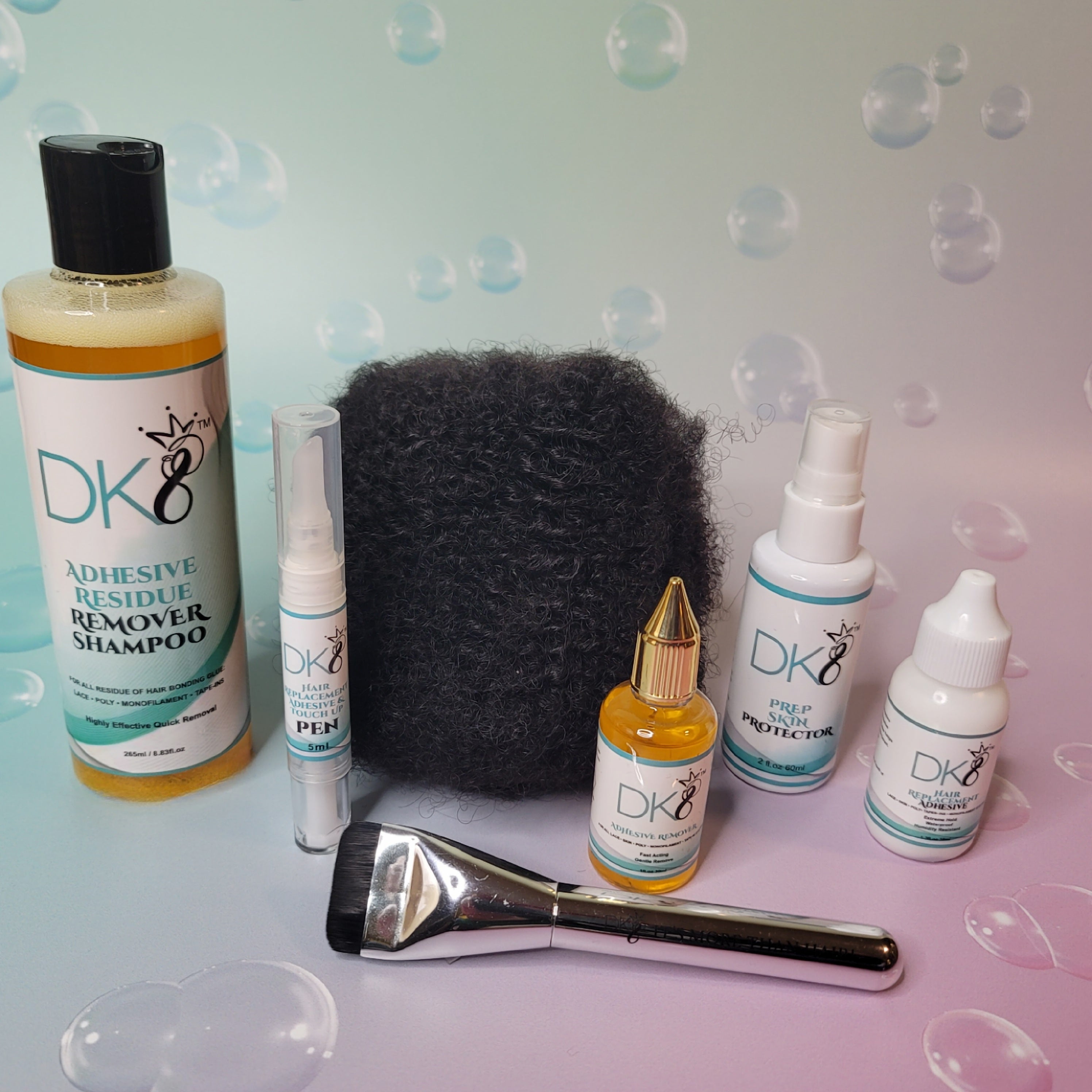 Collection of DKEight hair care products on a textured background